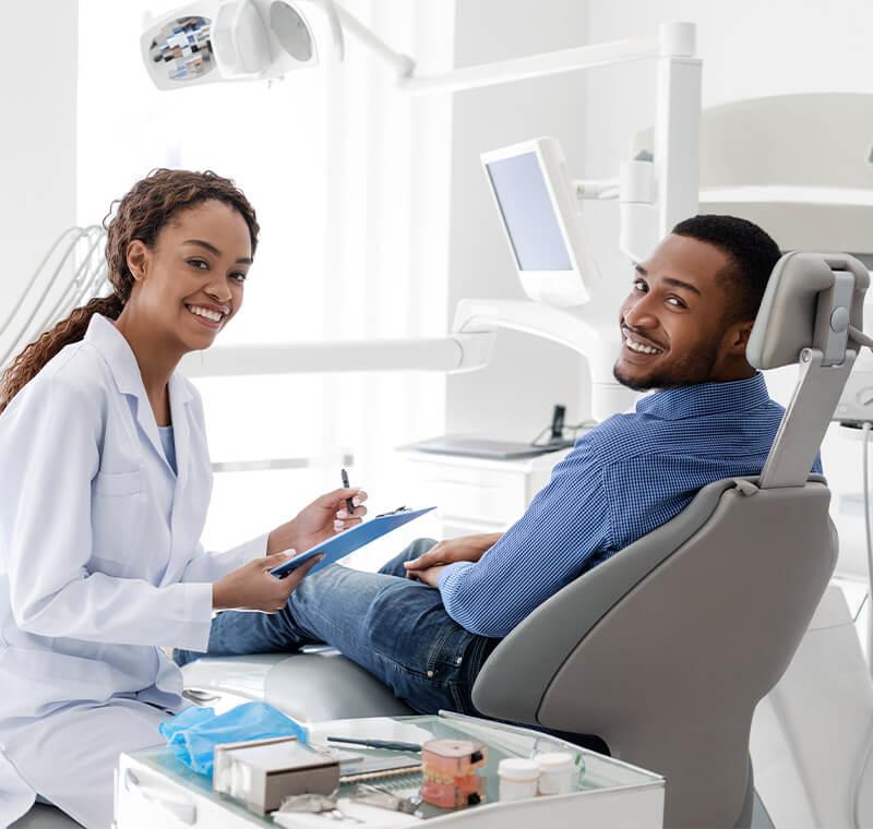 Dental assistant with a patient in a dental office.
